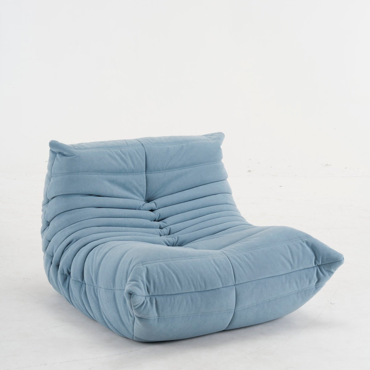 Togo light blue suede armchair