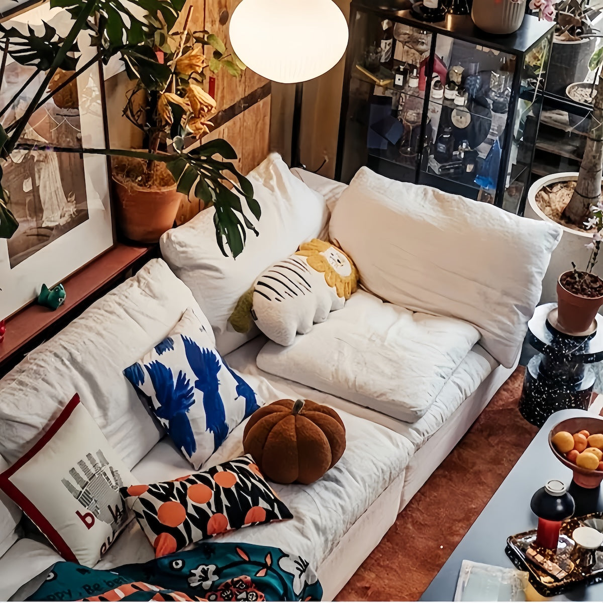 White cloud sofa with decorative pillows in a cozy living room setting
