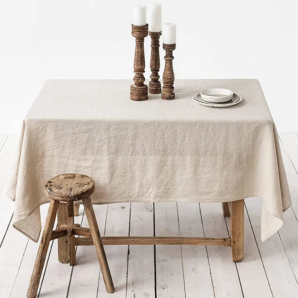 Linen rectangle tablecloth in beige with rustic dining setup.