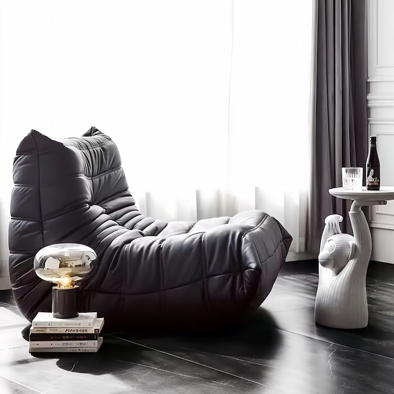 Togo Chair Fiber Leather Replica by Michel Ducaroy in modern living room setting.