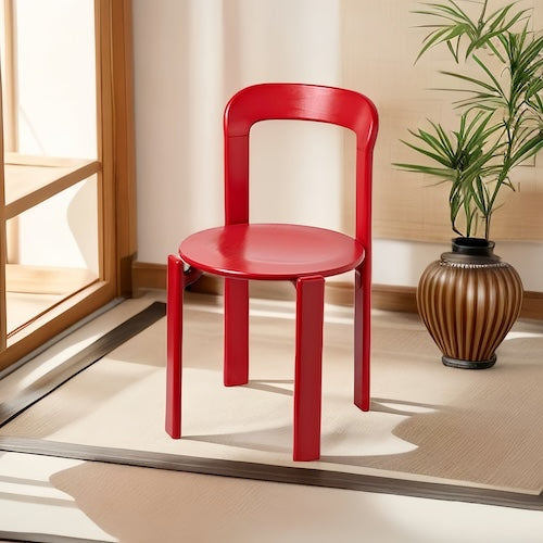 Red eco-friendly beech wood dining chair in a modern interior setting.