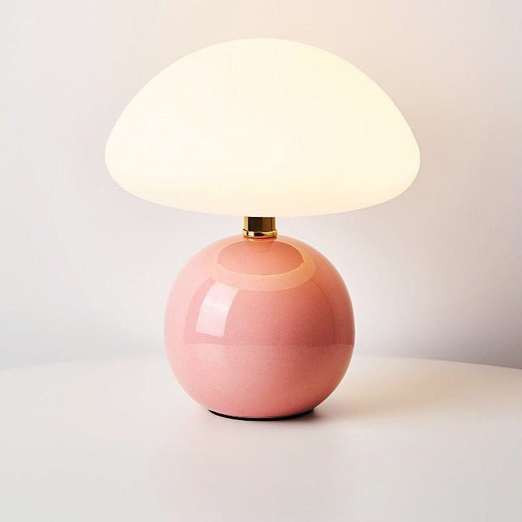 Ceramic table lamp with mushroom shape and LED light, pink base, ideal for cozy ambiance and home decor.