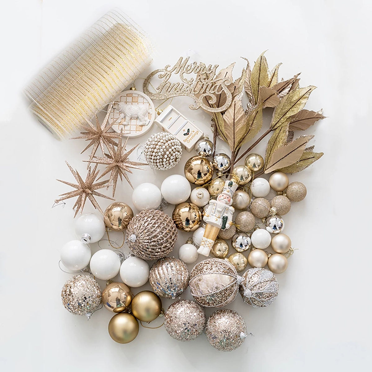 Decorative Christmas wreath with gold, white, and bronze ornaments on a white background