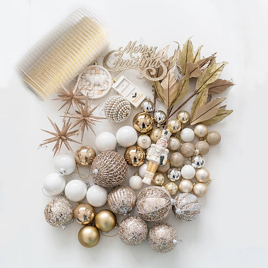Decorative Christmas wreath with gold, white, and bronze ornaments on a white background