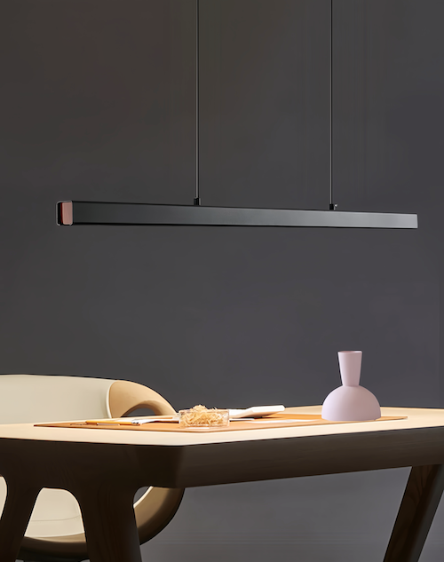 Minimalist black pendant light with dimmable LED over table, modern design, adjustable hanging wire.