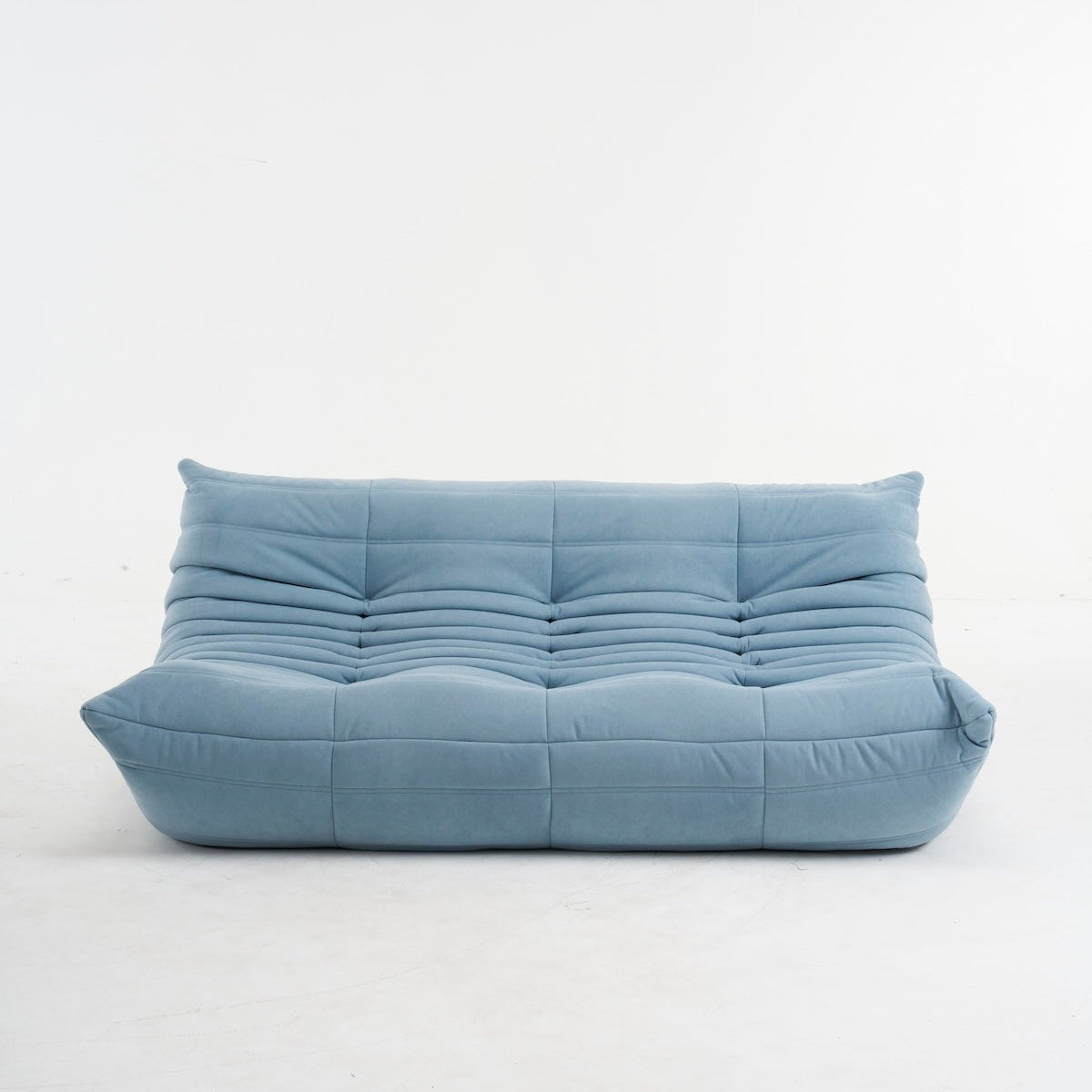 light blue togo couch in suede