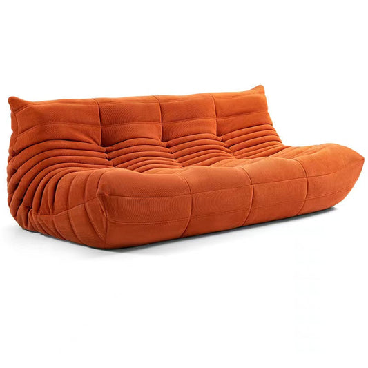 Togo 3 seater couch in orange corduroy fabric.