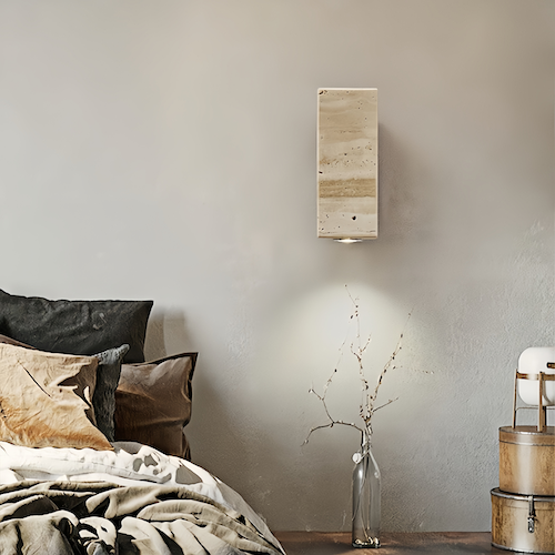 Natural travertine stone wall light in bedroom setting, offering ambient lighting and stylish Zen decor.