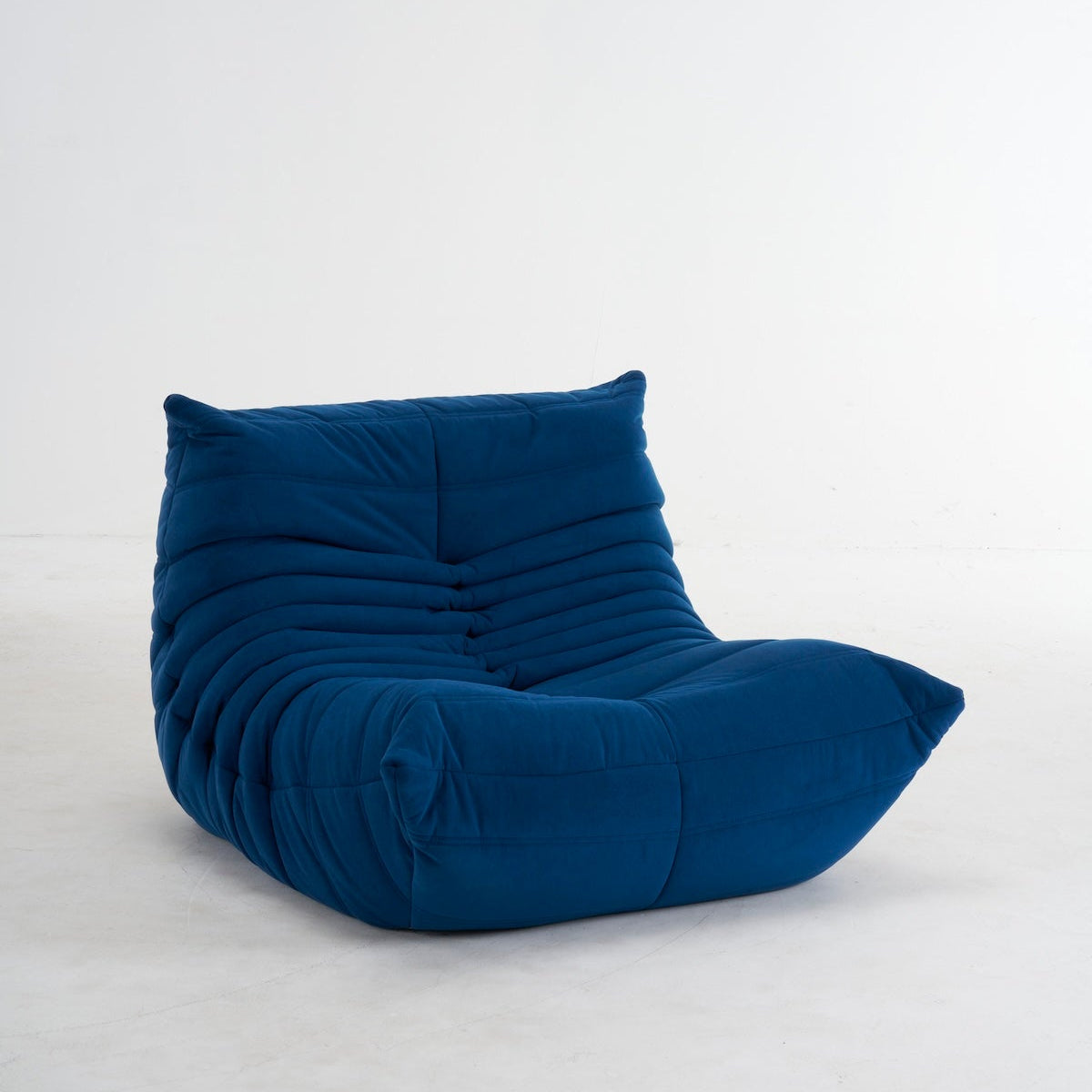 navy blue togo armchair in suede