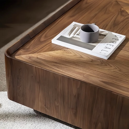 Walnut coffee table with storage, featuring a smooth, concave tabletop design and natural wood grain patterns.