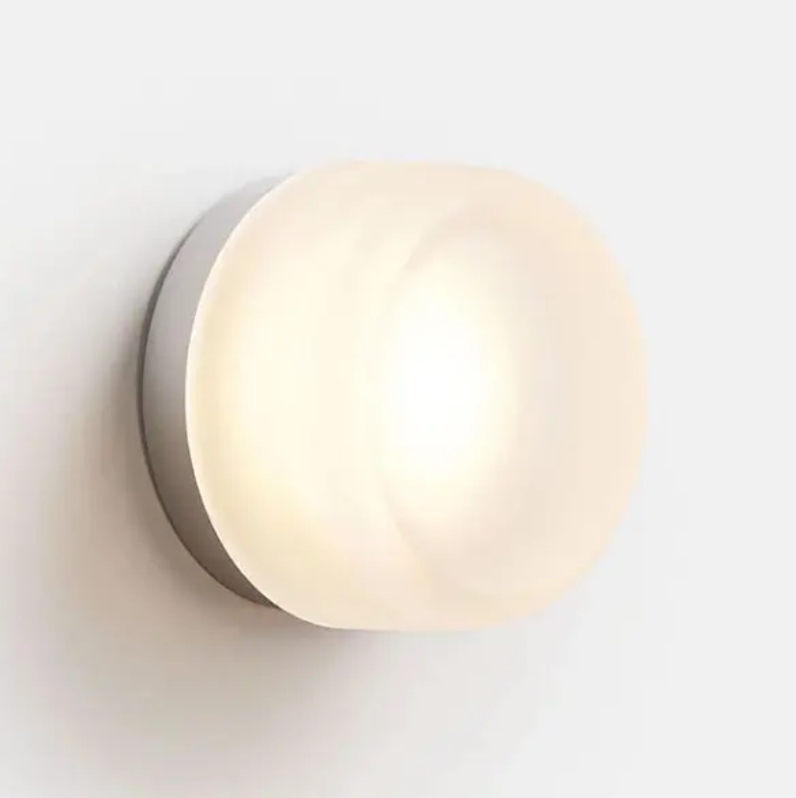 Wall sconce lighting with warm white light, acrylic and iron shade.