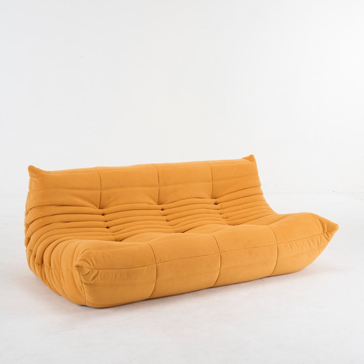 Mustard yellow bean bag chair on a white background